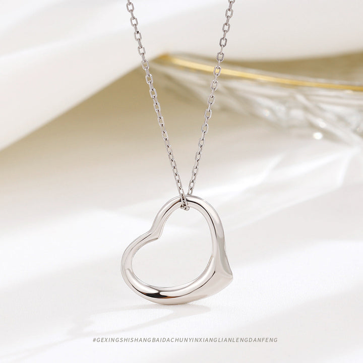 Ornement minoritaire capricieux S925 Collier de coeur creux en argent sterling