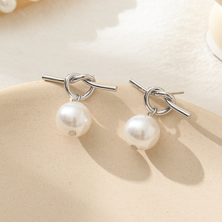 Pendientes de alerta de perlas con perlas anudadas de moda para combates