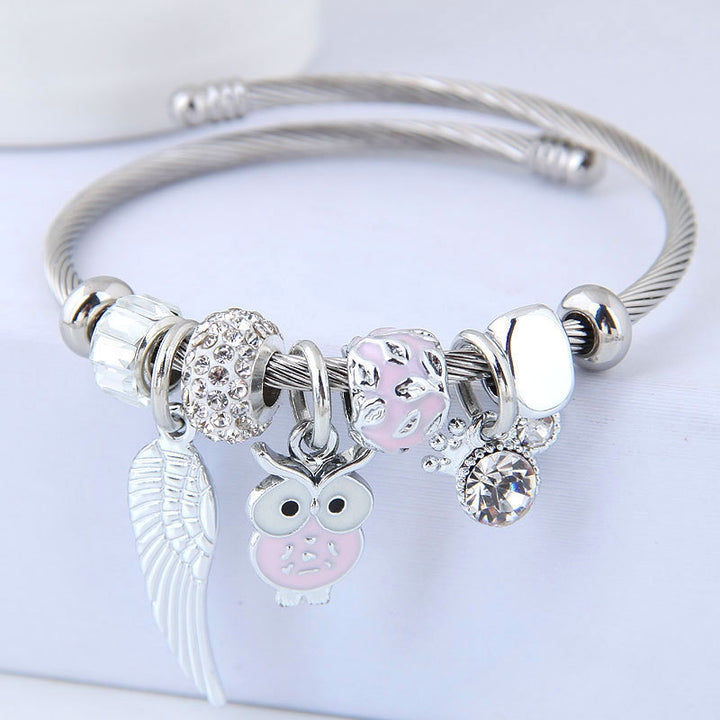 Sciatháin aingeal owl feirbthe DIY bracelet cruach dhosmálta pendant