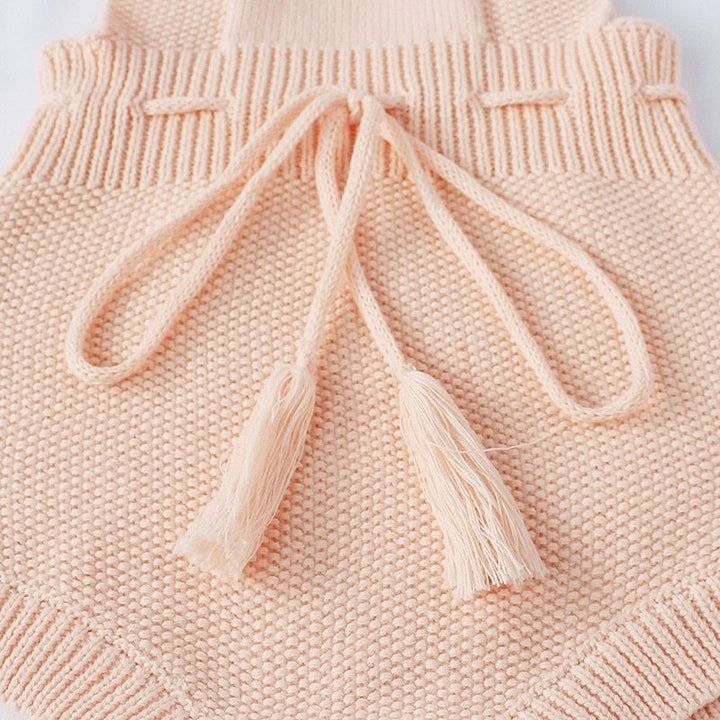 Knitted woolen jumpsuit for babies and toddlers