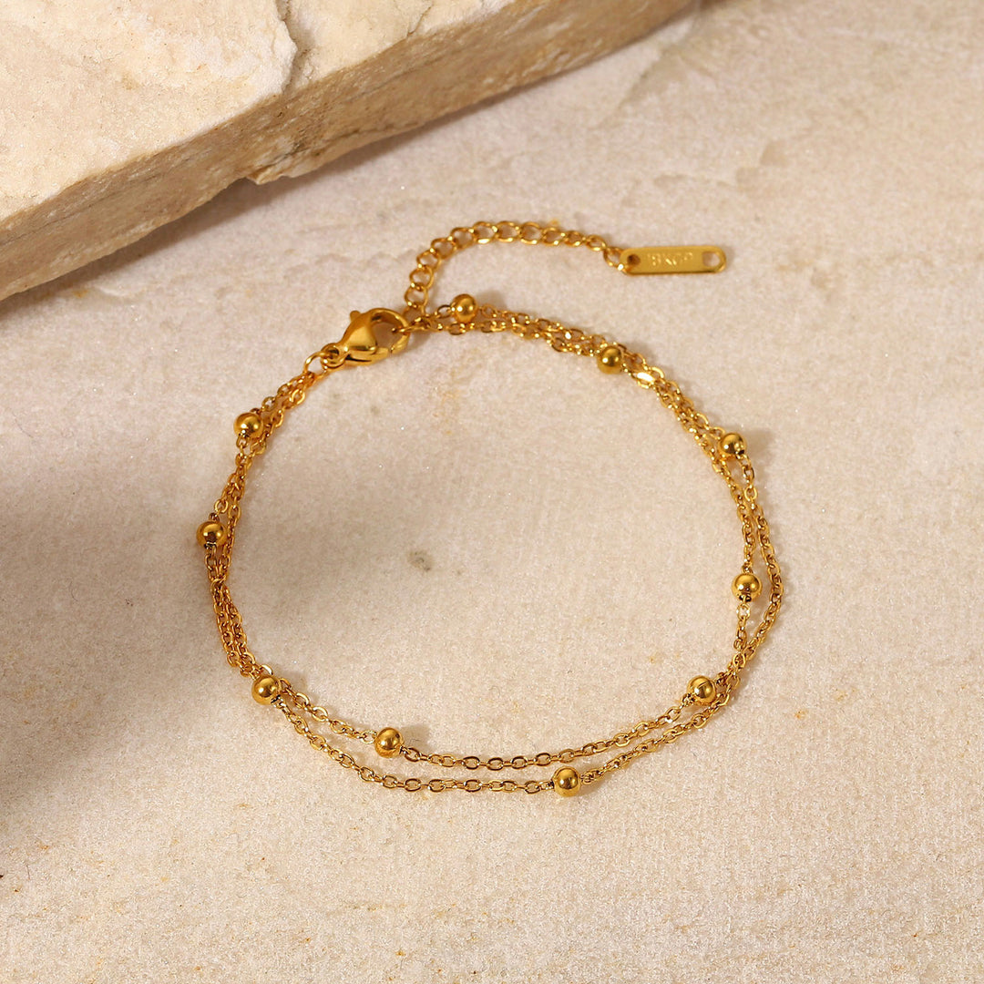 Exquisites 18K Goldperlen Halsketten elektroplattierte Titan-Stahlschmuck wasserdichte Doppelschichtketten Armband-Origination Frauen