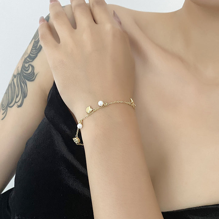 Moda femenina Elegante brazalete de carcasa de perlas