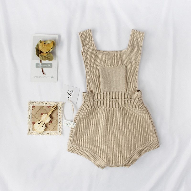 Knitted woolen jumpsuit for babies and toddlers