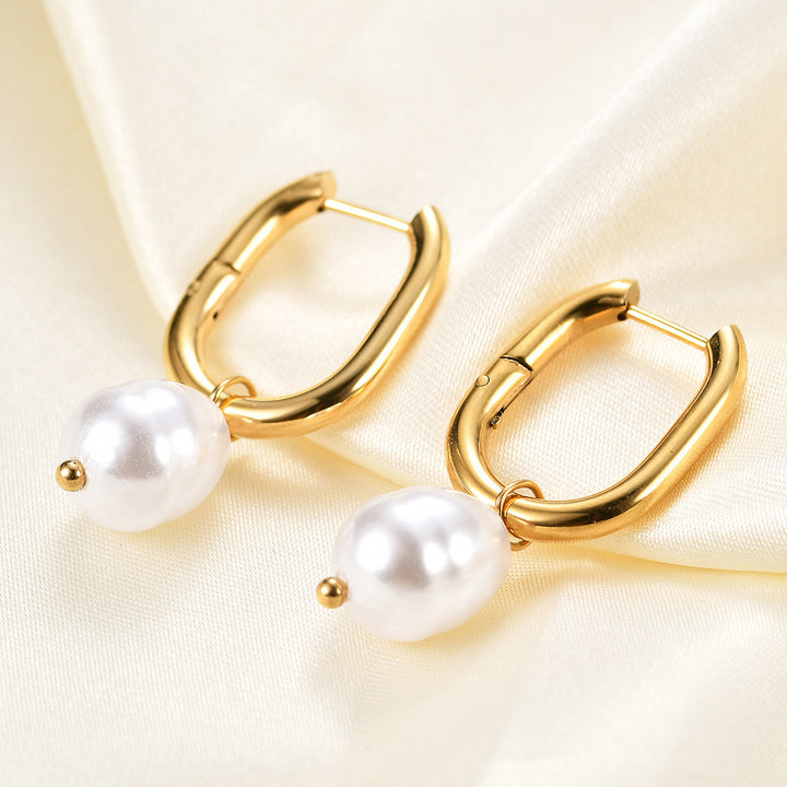 Pendientes de sementales huecos en forma de perla de la moda femenina