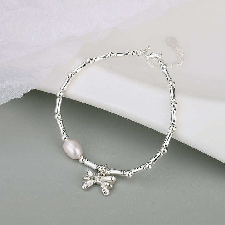 Koude stijl Pearl bow -armband