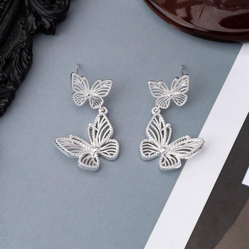 Zilveren naald vlinder holle oorstudier retro