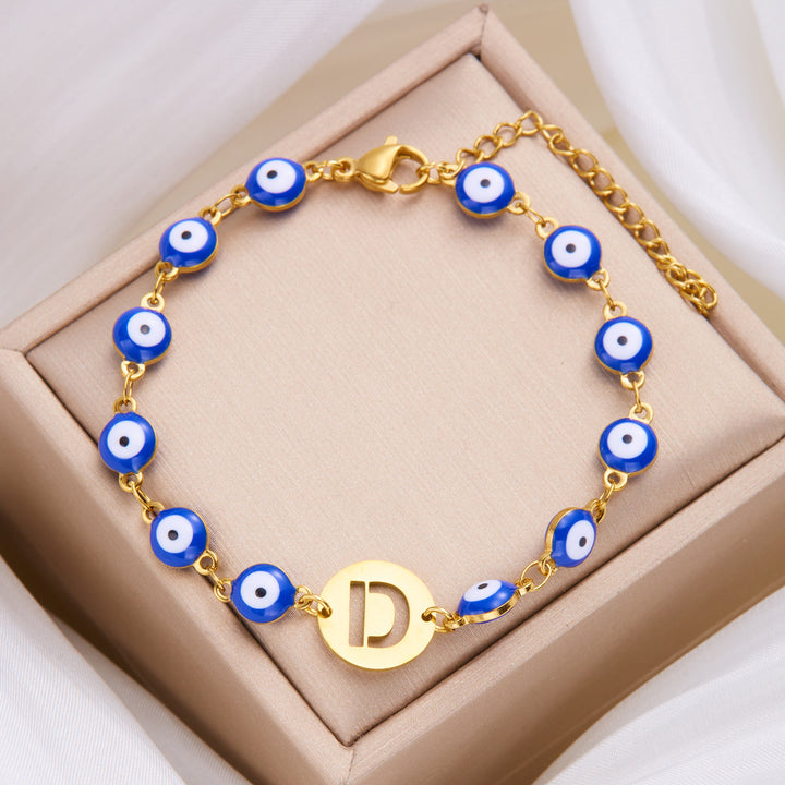 Women's High-grade Stainless Steel Blue Eyes Fashion Hollowed-out 26 Letter Bracelet