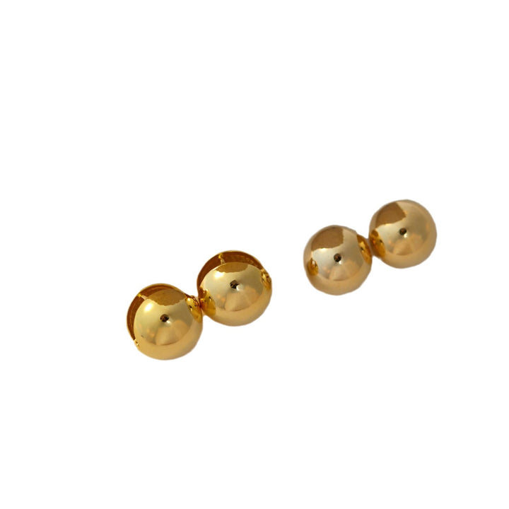 Pendientes de tachuelas de bola dorada Sentido de diseño de mujeres