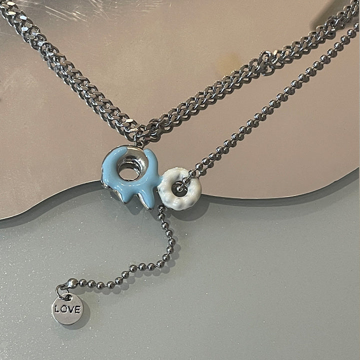 Collier à gland beignet bleu et blanc