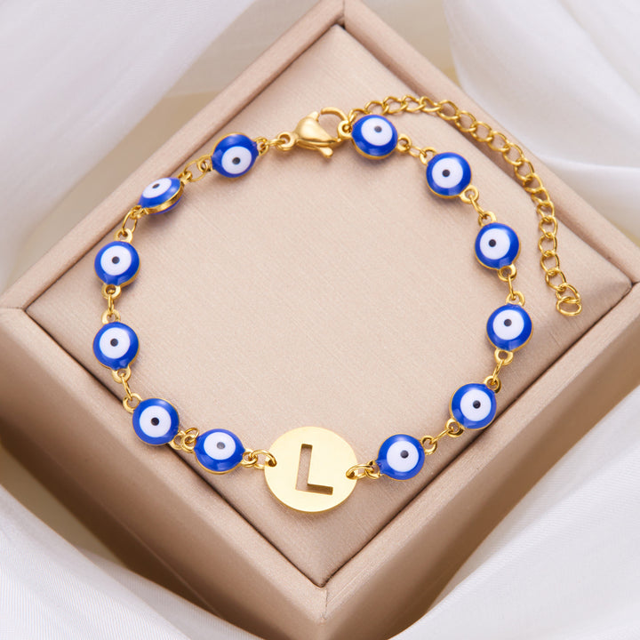 Women's High-grade Stainless Steel Blue Eyes Fashion Hollowed-out 26 Letter Bracelet