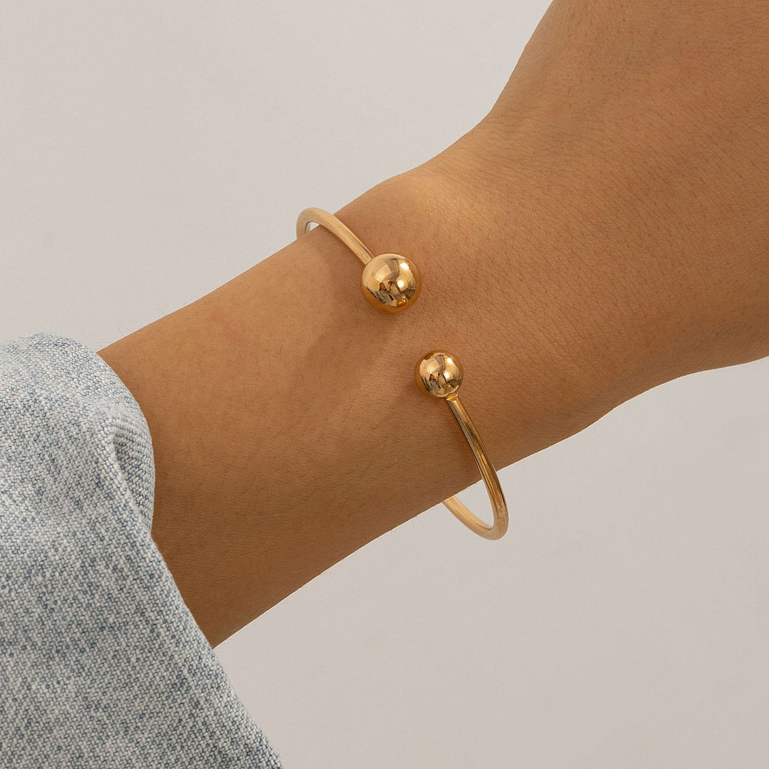 Ontwerp dubbele laag holle knoop open bracelet vrouwen