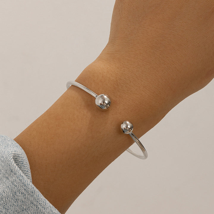 Ontwerp dubbele laag holle knoop open bracelet vrouwen