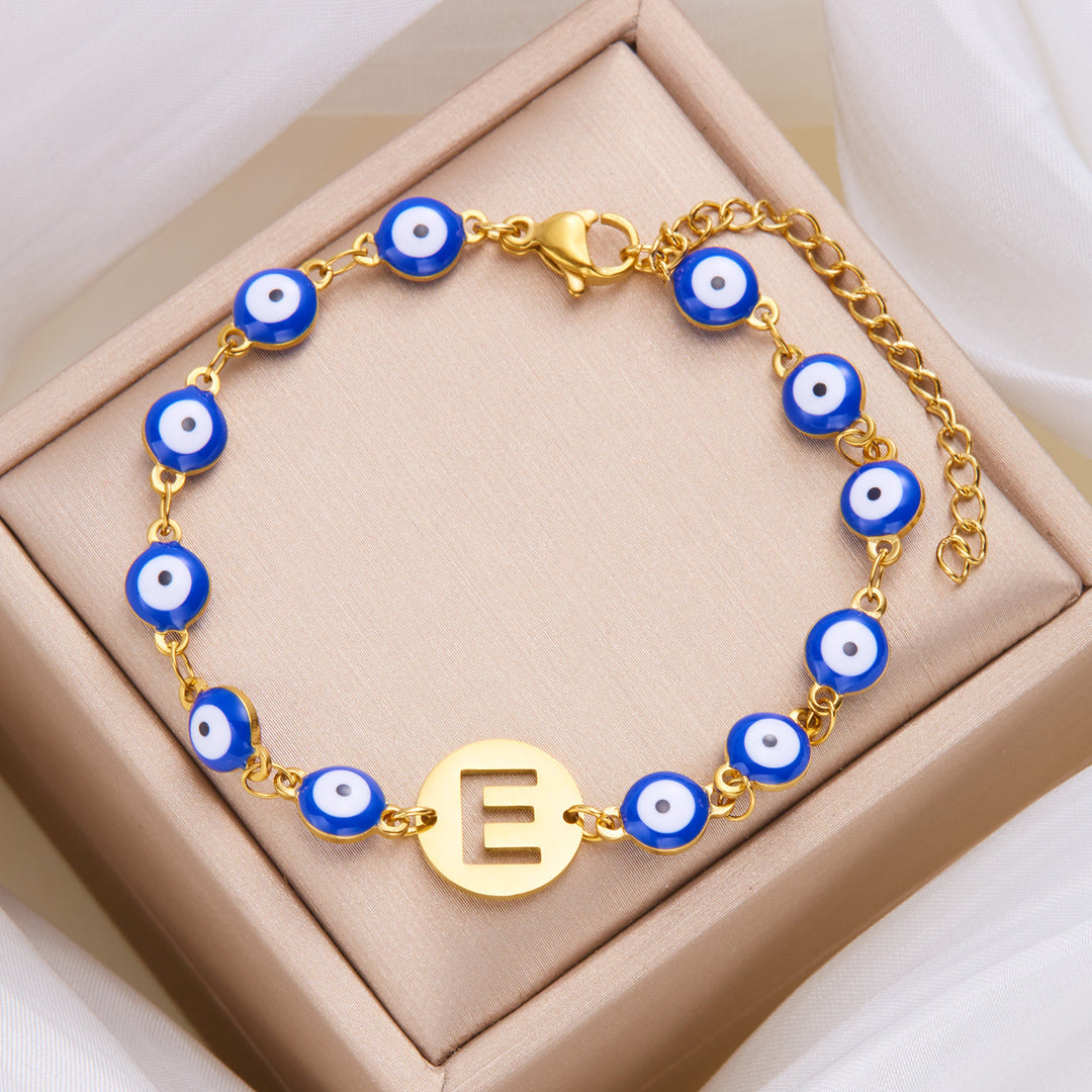 Women's High-grade Stainless Steel Blue Eyes Fashion Hollowed-out 26 Letter Bracelet