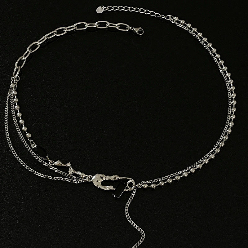 Black Diamond Pin Stitching Cross Tassel Necklace