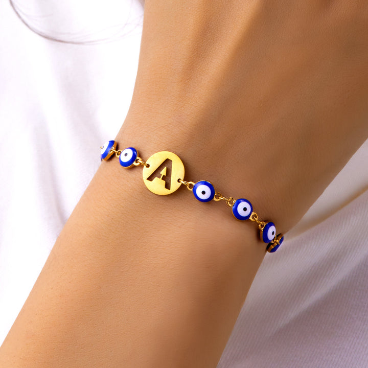 Women's High-grade Stainless Steel Blue Eyes Fashion Hollowed-out 26 Letter Bracelet