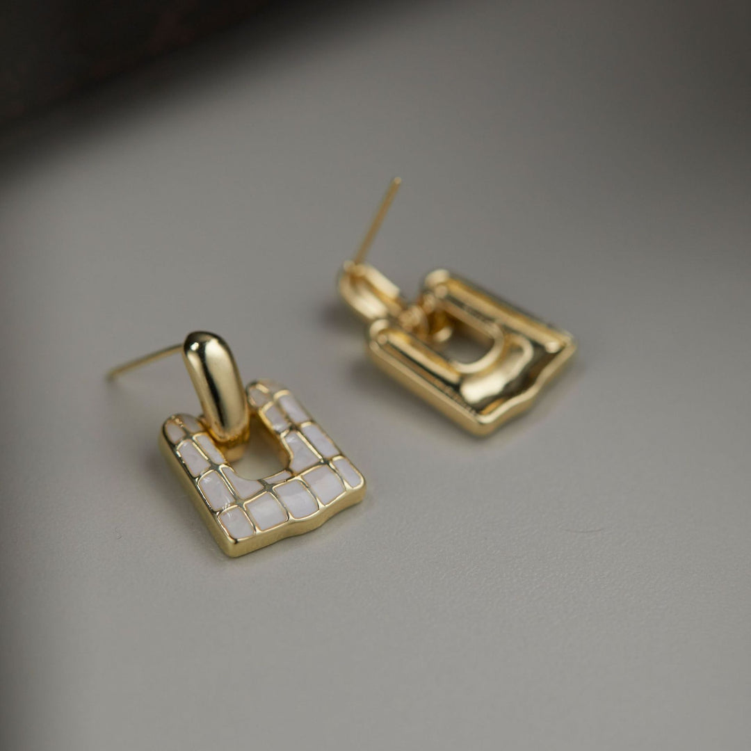 Boucles d'oreilles de niche exagérées en coquille