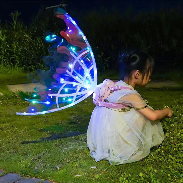 Filles ailes de papillon électrique avec des lumières brillantes habillées brillantes
