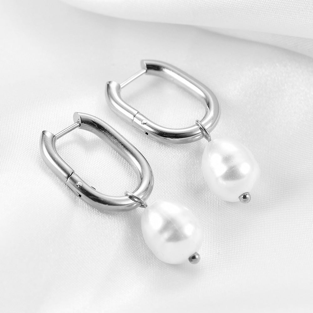 Pendientes de sementales huecos en forma de perla de la moda femenina
