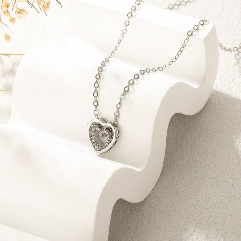 Japanse en Koreaanse minimalistische ketting met dubbele hart, modieuze en veelzijdige, volledige diamant holle kristal dubbele hart hanger, sleutelbeenketting